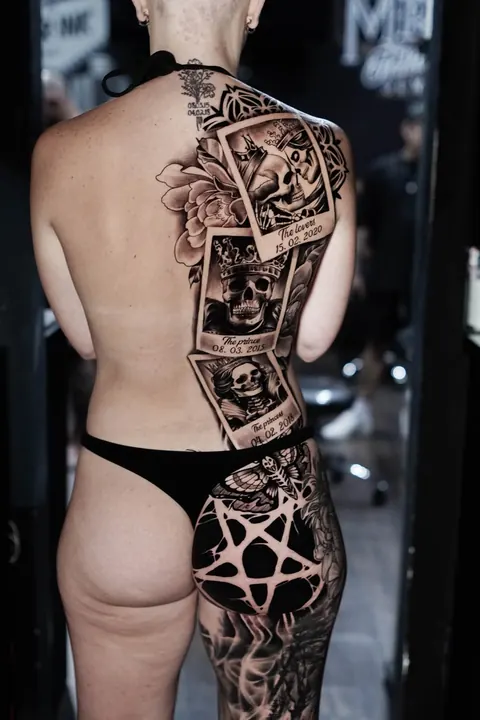 Black and grey skull polaroid back piece with peony and pentagram hip piece, tattooed at Mr Ink Bali in Seminyak